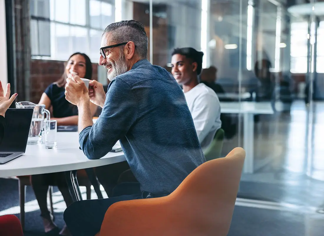 Meeting with Colleagues in a Modern Office